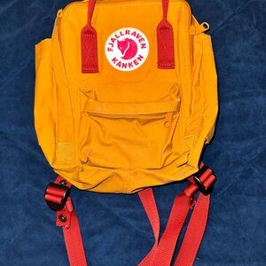 Fjallraven Kanken Backpack in Yellow and Red